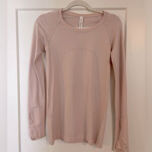 Light pink lululemon Swiftly Tech long sleeve top in size 6
